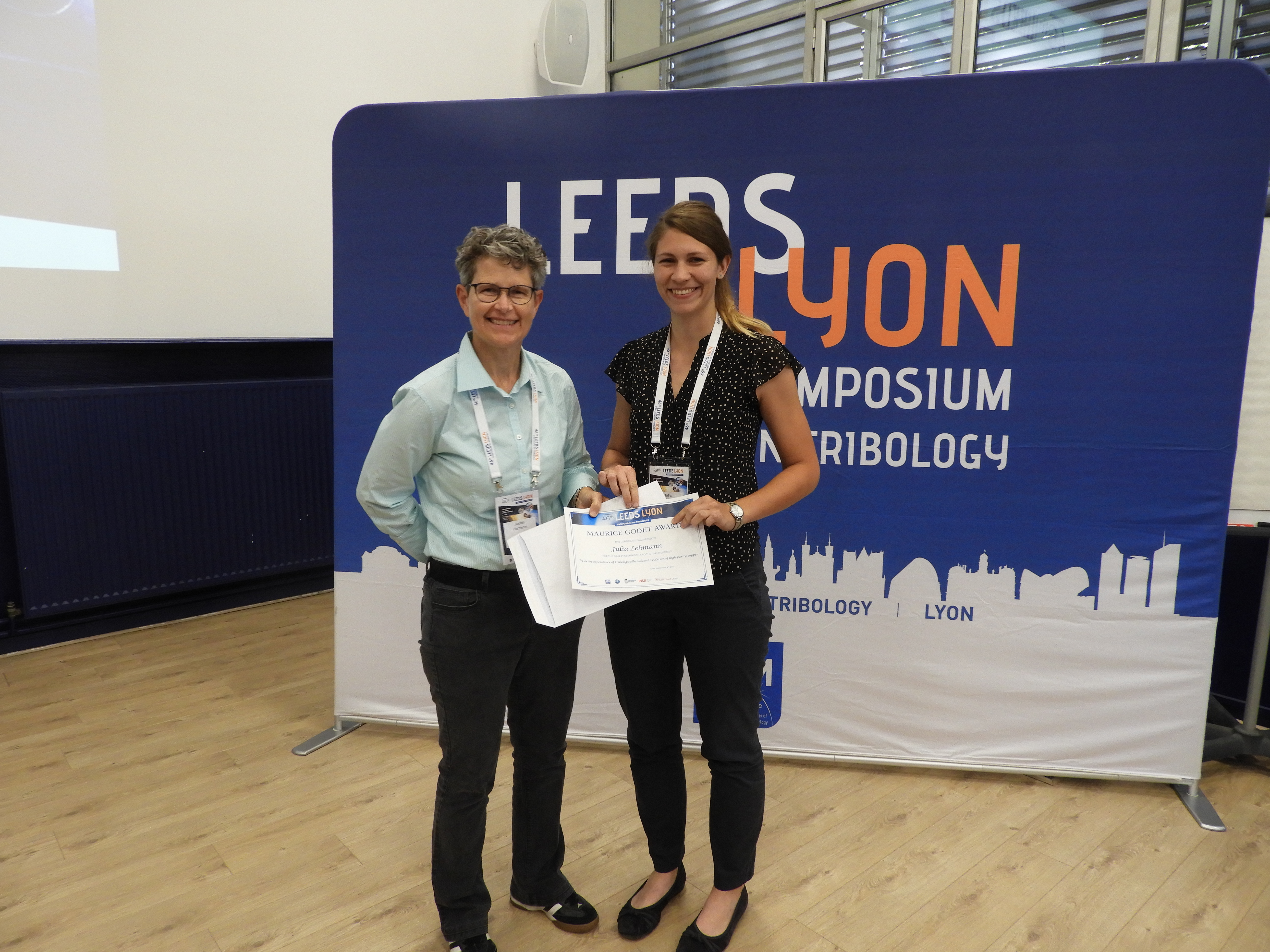 Julia Lehmann (right) receives the 2019 Maurice Godet Award from Judith Harrison (left)